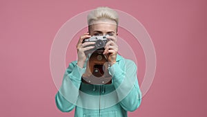 Portrait of a blonde-haired girl looking through the camera lens