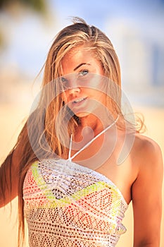 portrait of blonde longhaired grey-eyed girl in white lace frock