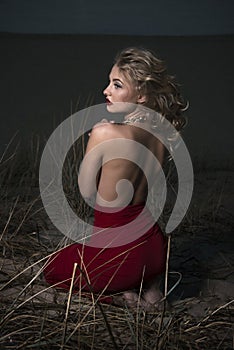 Portrait of a blonde on a night beach