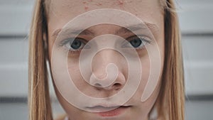 Portrait of a blonde teenage girl. Face close-up.