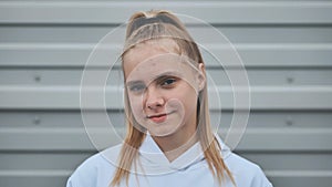 Portrait of a blonde teenage girl. Face close-up.