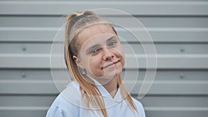 Portrait of a blonde teenage girl. Face close-up.