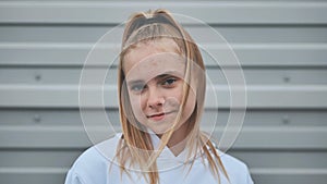 Portrait of a blonde teenage girl. Face close-up.