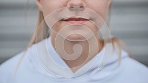 Portrait of a blonde teenage girl. Lips close-up.