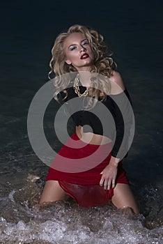 Portrait of a blonde in water
