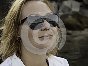 Portrait of a blonde Woman enjoying the beach in Summer. Sunset in Koh Tao, Thailand