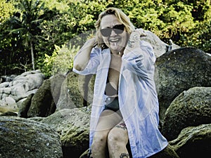 Portrait of a blonde Woman enjoying the beach in Summer. Sunset in Koh Tao, Thailand