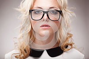 Portrait of blonde woman wearing eyeglasses