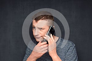 Portrait of bored man listening somebody on phone