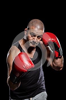 Portrait of boxer performing uppercut photo