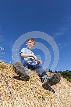 portrait of a boy against a blue sky