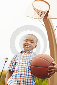 Portrait Of Boy On Basketball Court