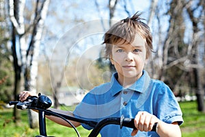 portrait boy with bicycle, outdoor
