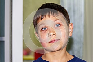 portrait of a boy with blue eyes close-up.