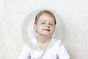 Portrait of a boy. The child`s emotions. Emotionally and beautifully. Expressive look.