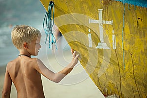 Boy with part of a boat