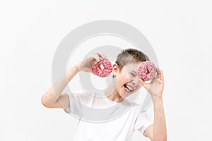 portrait of a boy with a donut on his face