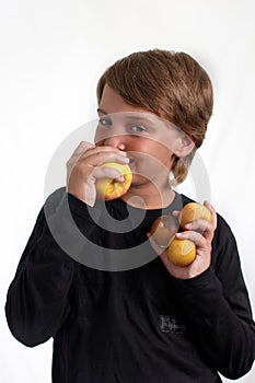 Portrait of Boy eating an apple .