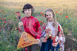 Portrait of a boy and a girl in the field.