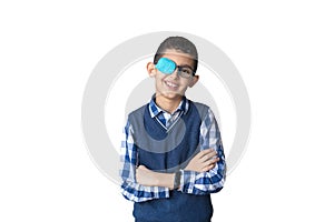 Portrait of boy in glasses with patch. Eye patch for glasses t treat lazy eye, amblyopia, strabismus