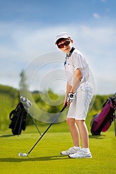 Portrait of boy golfer