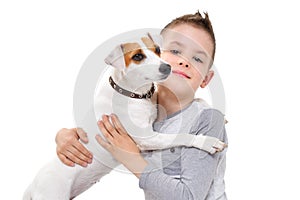 Portrait of a boy hugging his dog Parson Russell Terrier