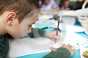 Boy learning calligraphy