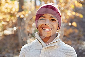 Portrait Of Boy Playing In Autumn Woods