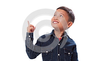 Portrait of boy pointing finger up.