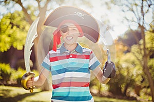 Portrait of boy pretending to be a pirate in the park