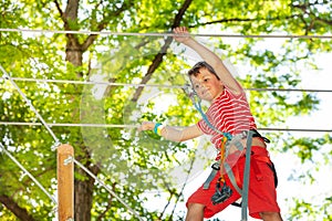 Portrait of a boy at rope climbing adventure park