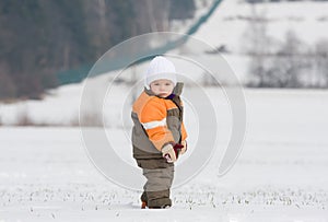 Portrait of boy in snowy landscape