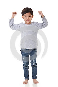 Portrait of boy standing in cheer up mood.