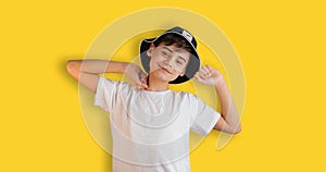 Portrait of boy stretching happily. Teenage Boy In Casual Style Outfit Isolated On Yellow Background. Back to school web