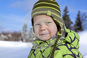 Portrait of a boy on sunny winter day