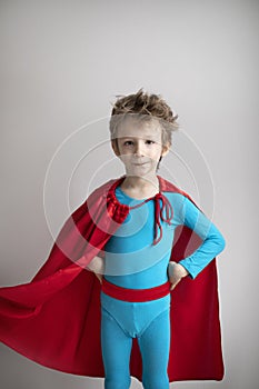 Portrait of a boy in a superhero costume. Success, motivation