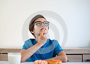 Portrait of a boy thinking on white background