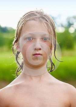 Portrait of a Boy with Wet Blond Hair.