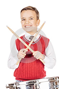 Portrait Boy young boy drumming on white background.