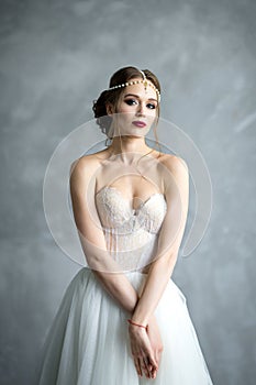 Portrait of a bride. Bride`s fees in the studio