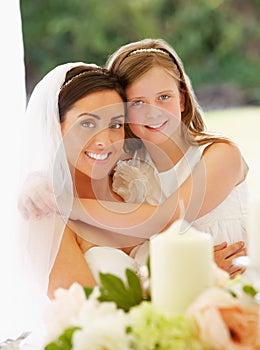 Portrait Of Bride With Bridesmaid In Marquee At Reception