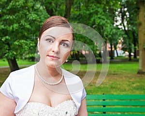 Portrait of a bride in a city park