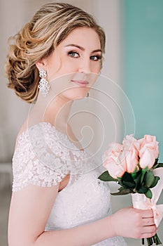 Portrait of bride in flower decor, studio photo. Beautiful Bride portrait wedding makeup and hairstyle, fashion bride model jewelr