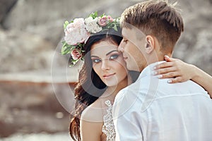 Portrait of the bride and groom close up. Loving caring tender c