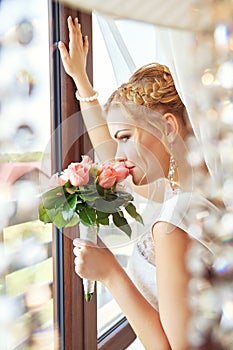 Portrait of bride near the window