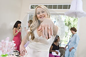 Portrait Of A Bride Showing Her Engagement Ring