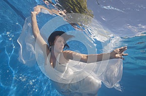 Portrait of bride underwater