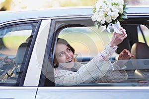 Portrait of a bride in a wedding limousine