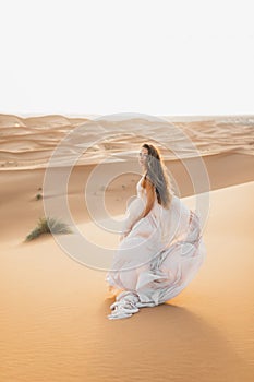 Portrait of bride woman in amazing wedding dress in Sahara desert, Morocco