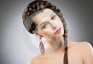 Portrait of Bright Brunette with Jewellery - Round Colorful Earring. Shining Bijouterie photo